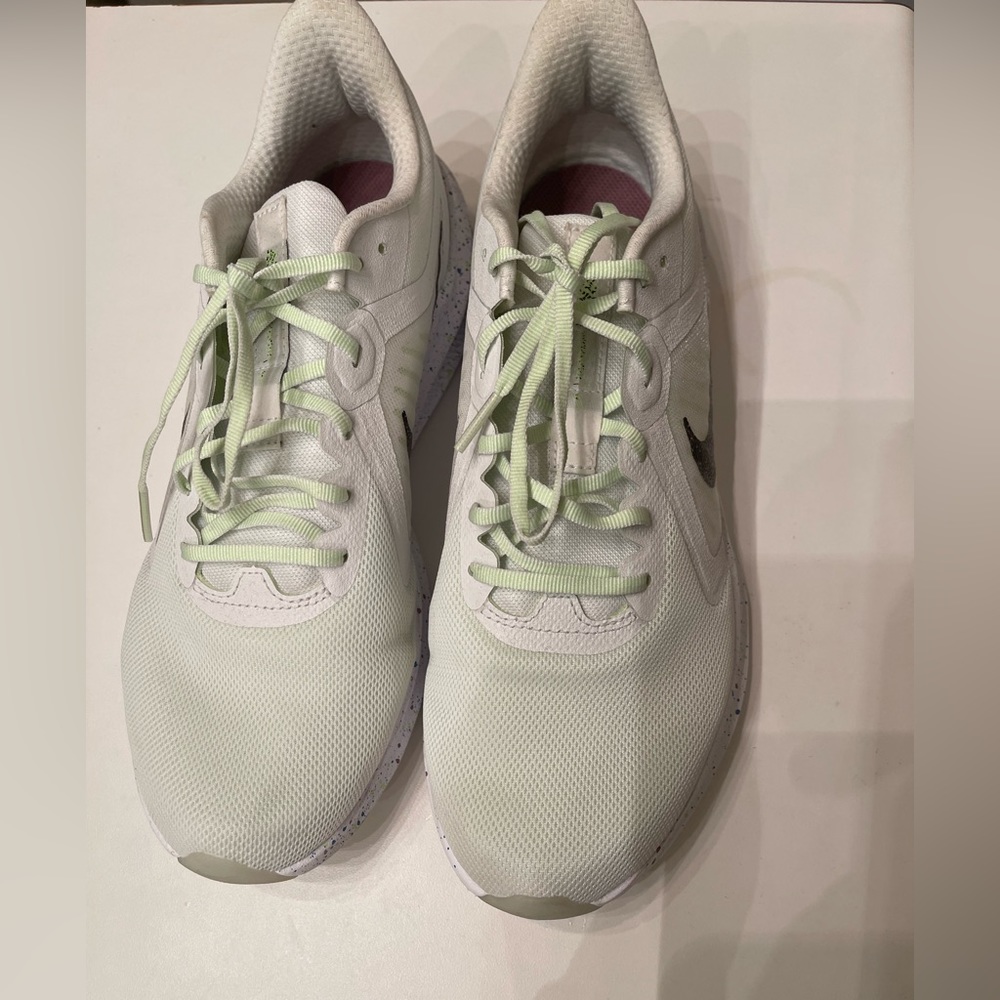 Wow look at these lime green and white Nike running shoes. Great buy!